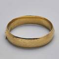 14k yellow gold hinged bangle florentine finish with bright cut decoration accommodates 7 18 dwt