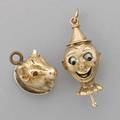 Two gold or goldtopped charms english 10k gold mechanical pinocchio charm enameled tongue and eyes moved by pull pin indistinct english date and maker marks 53 dwt 10k gold topped bull with ru