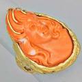 Large coral cameo 18k gold freeform ring teardrop shaped carved orange coral 35 x 22 mm depicts young woman ca 1970 unmarked size 8 174 dwt