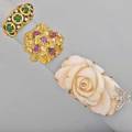 Three gold diamond and gem set rings four emerald cabochons and diamonds size 4  carved angel skin coral white gold diamond butterfly accent size 9 12 18k yg cluster form with fire rubies si