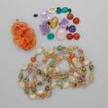 Hardstone jewelry and unmounted gemstones twenty pieces vegetal carved red jade pendant 2 14 x 1 12 h stern brazilian necklace with pebbles in gf cages 44 eighteen unmounted gems includi