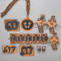 Frank rebaje modernist copper jewelry ten pieces seven pieces brazilian mask patinated suite includes link bracelet 1 34 x 6 34 three brooches largest 2 12 x 2 disc pendant on chain s
