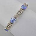 Late victorian gemset bracelet six oval faceted blue sapphires approx 15 cts tw in millegrained bezels joined by leafy links set with rose cut diamonds silvertopped gold 6 12 118 dwt