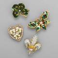 Four american belle epoque enameled gold brooches 14k gold and diamond butterfly 14k gold and diamond pansy cluster in seed pearl heart 14k gold and diamond fleurdelis with hinged pendant bail an