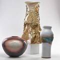 Studio ceramics three pieces rakufired spherical vase glazed stoneware vase and figural umbrella stand 20th c some marked tallest 22
