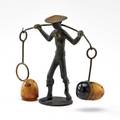 Franz hagenauer richard rohac bronze figure of an asian man carrying bakelite salt and pepper shakers mid 20th c marked 4 12 x 5 x 2