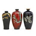 Japanese cloisonne vases three early 20th c red with dragons black with three cranes and enameled overlay dragon on wire ground tallest 4 34