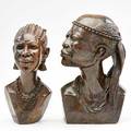 Rutendo tendai zimbabwe b 1963 jethro dodzo two shona verdite stone sculptures one of a man and the other a woman late 20th c both signed r j dodzo taller 11 14