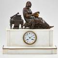 French figural mantel clock alabaster base surmounted by a bronze patinated spelter figure of a woman studying geography 19th c movement marked 17 x 18 x 6