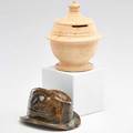 George ohr two novelty pieces bisque bank and hat with melt fissures biloxi ms 18951900 both stamped taller 5 14