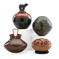 Native american or mexican pottery four items late 20th c deeply carved redware by nancy youngblood lidded jar by dora tsepe twocolored jar by jesus lozano and a handled vessel by olga quezada