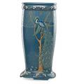 Frederick h rhead 1880  1942 roseville decorated mat umbrella stand squeezebagdecorated with peacock and trees zanesville oh ca 1910 signed hr to body incised 724 to base 20 x 9