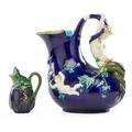 Minton two majolica pitchers larger carved with daphne smaller with frog on eggplant england 18511874 larger stamped minton 1420dartists cipherdate code smaller stamped with numbersminto
