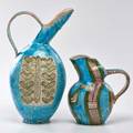 Guido gambone two large pitchers italy 1950s glazed earthenware both signed taller 20 note the larger pitcher bears the gambone exhibition mark a large g with the number 51 inside it indi