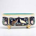 Majolica footed planter with bird decoration 20th c glazed earthenware illegible marking 7 12 x 17 34 x 8 12