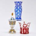 Viennese glass three pieces molded glass vase with blue circular decoration footed bowl with floral decoration and lidded compote decorated with enamel and gold leaf 20th c all unmarked talles