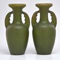 Clement massier pair of matte green twohandled vases france early 20th c both stamped with illegible marks each 11 34 x 4 34 dia