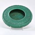 Teco low bowl 136 decorated with leaves and berries in a matte green glaze with charcoaling terra cotta il ca 1905 stamped teco twice 2 x 9 12 dia