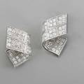 Piaget diamond 18k white gold stardust earrings designed as ribbons 80 bead set round brilliant cut diamonds approx 3 cts tw ca 2005 left and right b65374 signed clip backs for pierced ea