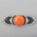 Art deco coral diamond and enamel platinum brooch buttonshaped orange coral 194 mm centers modified bowshaped brooch set with omc diamonds approx 82 ct tw 90087 ca 1935 2 58 x 34 1