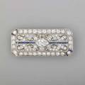 Art deco diamond sapphire platinum panel brooch canted rectangle centers navetteshaped diamond approx 75 ct and square baguette cut diamonds approx 335 cts tw on scroll openwork ground wi
