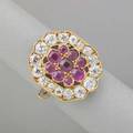 Ladies diamond and ruby 18k gold dress ring canted rectangular cluster of 16 oec and transitional cut diamond and nine circular cut rubies split shank set with diamonds pierced gallery ca 1930 d