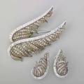Diamond plume 18k gold brooch and earrings double plume brooch champagne diamonds on black patinated feathers with colorless diamond and white gold spines 2 78 x 1 34 companion earrings 1 12