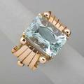 Retro 14k rose gold aquamarine ring modified emerald cut aquamarine 178 x 123 x 91 mm approx 12 cts with beaded ribbon shoulders ca 1945 size 7 58 dwt