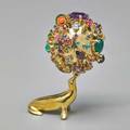 Ruven perelman jeweled 18k gold fur clip uniquely large and whimsical solid cast gold sea lion with diamond eyes balances a colorful multigem sphere articulated ca 1965 signed ruven 18k spher