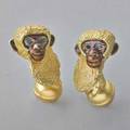 Tiffany  co enameled gold monkey cufflinks figural monkey busts naturalistically rendered with brown 18k gold enameled faces and ears faceted sapphire eyes hairy fixed bar paw and ball terminals