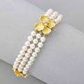 Tiffany  co pearl and diamond dogwood bracelet triple strand cultured saltwater pearls 5  45 mm and three textured blossoms with diamond clusters one conceals clasp 18k gold 1990s marked t