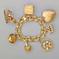 14k gold charm bracelet triplelink bracelet suspends seven large 14k gold charms champagne in ice bucket photo album heart multilocket jeweled sled christmas manger with lords prayer stanhop