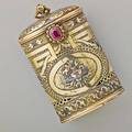 Four color gold and ruby pomander case oval pierced and chased in the louis style with colored gold and silver applique hinged lid with bail ruby thumbpress ca 1800 unmarked 3 402 dwt