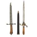 German hunting daggers two 19th20th c one with ivory grip and etched decoration the other with shell langet and acorn finials longer 14 12