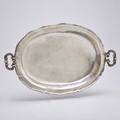 Large south american silver serving bowl shallow oval form with piecrust edge raised from a solid sheet forged scroll handles drop from heavy forged rings 19th c 25 x 17 12 1561 ot