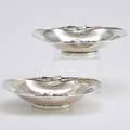 Two georg jensen denmark blossom dishes 2a sterling kidneyshaped dishes with open floral edges above conforming ring foot 19251932 7 58 x 5 12 1589 ot tw