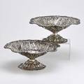 Pair of howard  co sterling rococo compotes chased bowl and dome foot floral pierced column and rim with applied flute and scroll edge nyc 1891 4 12 x 10 34 501 ot