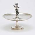 Gorham figural sterling fruit bowl round footed bowl centered by fifeplaying putto and aesthetic chasings 1868 monogram f on foot 8 12 x 10 3061 ot