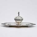 Tiffany  co medallion sterling inkwell central cupshaped well figural putti finial on hinged lid on oval tray with philosopher medallions 18601869 10 12 12 ot
