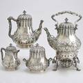 Tiffany  co sterling coffee service four pearshaped vessels with floral and acanthus chasing fluted collars and lids ivory insulators rusticated branch handles and leaf spout includes kettle o