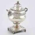 Southern coin silver sugar urn bulbous with rams masks below scroll handle square pedestal foot above griffon bracket feet rosebud finial alexander young camden south carolina active 18071856