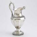 American coin silver water pitcher faceted urn form with applied acanthus and leafy ribbons upswept ear handle inscribed inside base to gilbert g newhall from benji cramer and accompanied by origi