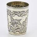 18th c russian gilt silver beaker taped cylindrical form chased with eagles on branches rocquille ribbons kiev 1774 assayer ivan savelyev marked for fyedor petrov moscow and other unrecognized