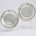 Pair of austrohungarian silver chargers 1781 undulating banded edge engraved armorial crest with crown vienna marks and m ii in oval on reverse 194 mj1532 and 175 m22 of a set 10 35