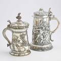 Two massive decorative silver plated tankards electroplated copper embossed with battle scene and vegetal borders 14 electroplated brass in the german style with twisted flute and rocquille decora