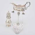 Georgian silver for the table fish trowel with elaborate piercings openwork cast handles thomas nash london 1765 baluster form sugar caster charles adams london 1707 sauce pitcher on shell