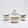 Four pieces irish silver holloware cushion shaped footed cream and sugar service with vertical flutes incised scroll reserves and quilting dublin 1790 indistinct maker rectangular wasted creamer