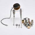 Silver sewing accessories seventeen pieces four sterling button hooks largest 8 twelve thimbles depicting paris exhibition 1889 the liberty bell lyon exhibition columbian world exhibition ex