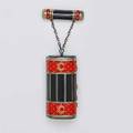 Enameled sterling necessary cylindrical box and chained lipstick holder with gilt highlighted red and black enamel in the napoleonic style mirrored interior fitted with ivory tablet and three compa