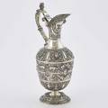 Hong kong british colonial sterling wine ewer urn form trophy embossed with caryatids masks goats and fruits in the renaissance revival style hinged gilt spout steven smith london 1871 neck i